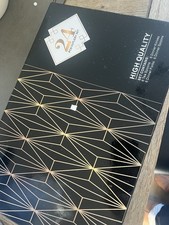 New and boxed 24 piece gold