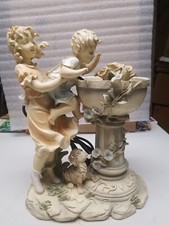 Resin Girl Holding Boy Up to a Water Fountain