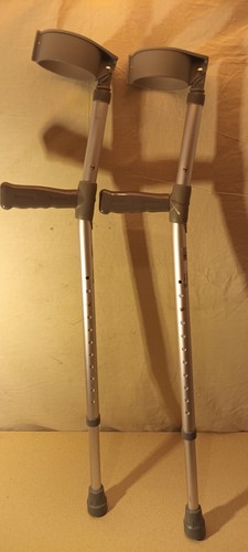 Pair adjustable crutches - of, by