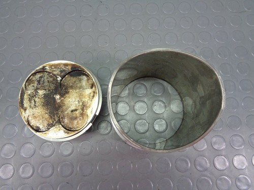 Cylinder and piston - and, rear