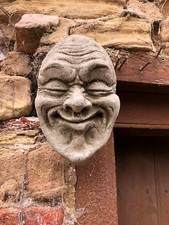 Stone face garden ornament wall hanging gurning statue funny smug smiler smile