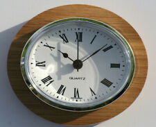 Oval Clock Suitable for Caravans, Motorhomes and Boats. Roman with silver bezel