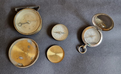 Two antique brass - , compasses