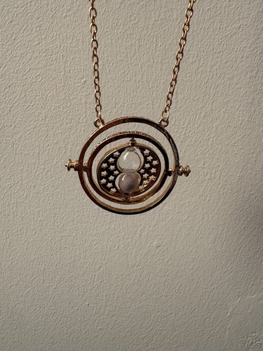 Gold tone spinning hourglass - gold,