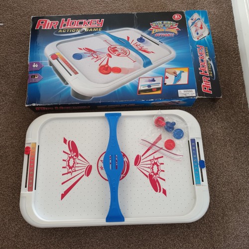 Air hockey table top action - top,