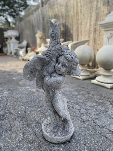 Boy and goose figure - and,