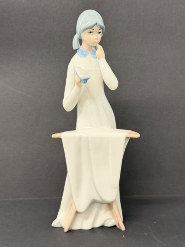 Casades young lady ironing - -,