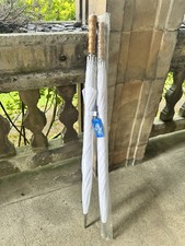 A pair of white umbrellas