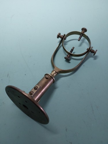 Old brass gimbal bracket for