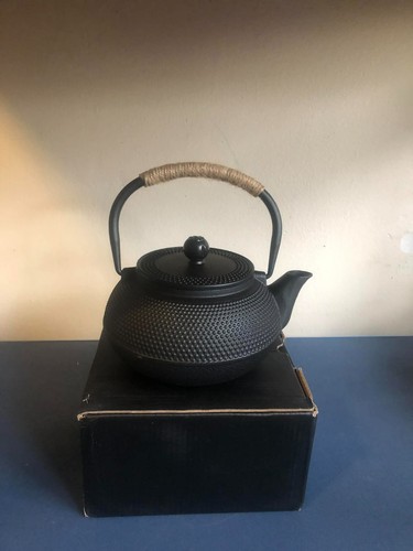 Cast iron kettle with tea - iron,