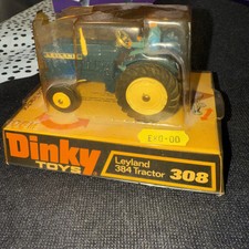 Vintage Dinky Tractor 308 in carded base and plastic topper 