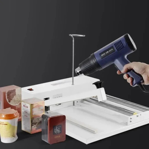 Shrink wrapping machine with - wrapping,