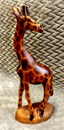Hand carved wooden giraffe - hand,
