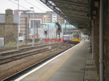 PHOTO  CLASS 142 AT NEWCASTLE STATION AN UNIDENTIFIED NORTHERN RAIL CLASS 142 UN