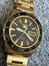 Seiko 5 Sports Black & Gold Men’s Watch Ref SRP196J1/SNZH60