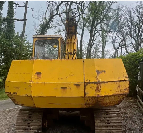Yellow tracked excavator - tracked,