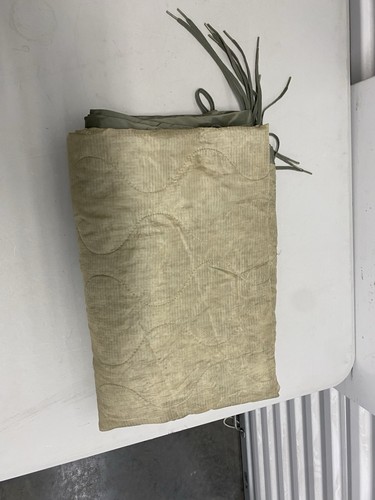 Damaged army poncho liner - damaged,