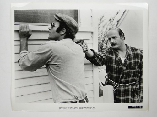 Man pointing gun back house - gun,