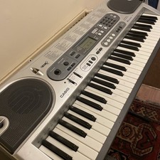 Casio LK-70S Portable Digital Keyboard Piano with Stand, mains plug and books