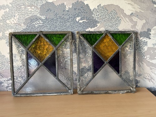 Pair coloured stained - a, of
