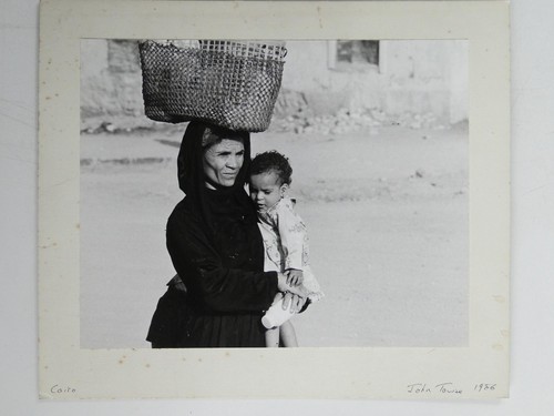 Woman carrying woven basket - carrying,