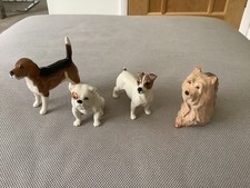 Collection of four Beswick dogs in perfect condition and in original boxes