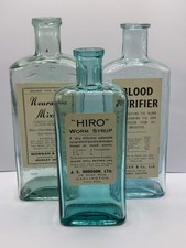 3 old chemist bottles with added chemist labels