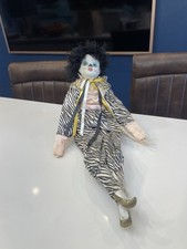 a vintage porcelain clown