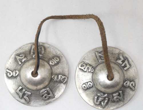 Tibetan tingsha cymbals raised - tibetan,