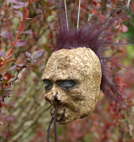 Black mohawk shrunken - head, car