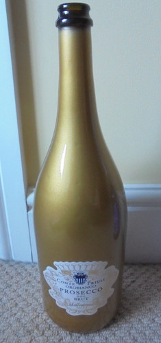 Empty gold coloured prosecco - coloured,