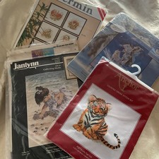 A BUNDLE OF CROSS STITCH KITS