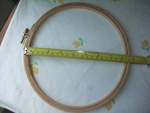 Wooden embroidery hoop by - a,