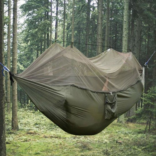 Person hanging hammock with - hanging,