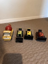 Four Tonka Toys. 1 Cement