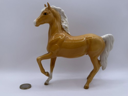 Beswick palomino prancing arab - prancing,