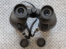 Nikon 7x50 6.2° Sporting II binoculars with lens covers and carrying case.
