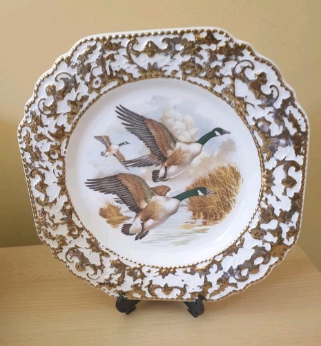 Decorative gilt flying ducks