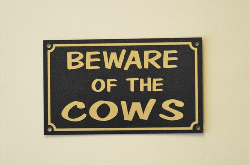 Beware the cows sign - of,