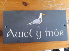 Welsh House sign on grey slate
