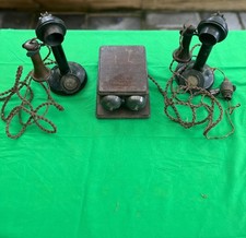 pair of antique  candlestick telephones and oak ringer box