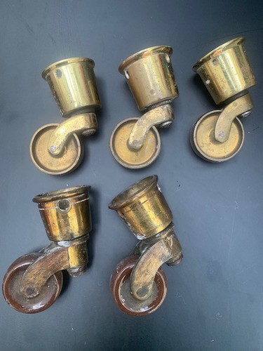 Antique brass casters - 3, plus