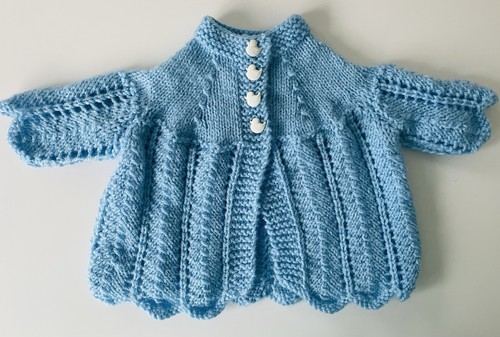 Hand knitted baby - hand,