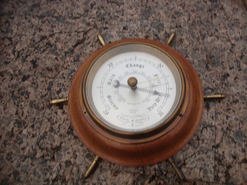 Brass barometer working by - ,