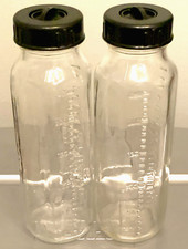 2 Vintage 50s/60s Evenflo 8oz Glass Nurser Baby Bottles w Black Lids & Disc Caps