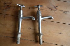 pair of vintage chrome cross head tall pillar taps
