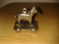Vintage silver tone horse on 4